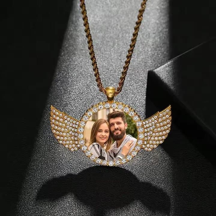 Gold winged photo locket pendant with rhinestones